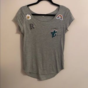 grey shirt with colorful patches